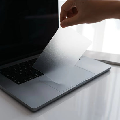 peeling clear matte film off MacBook trackpad