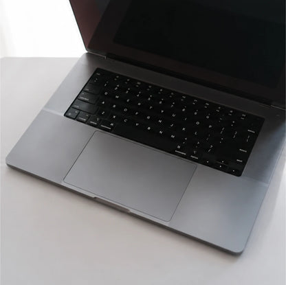 MacBook top view with keyboard skin and clear trackpad protection
