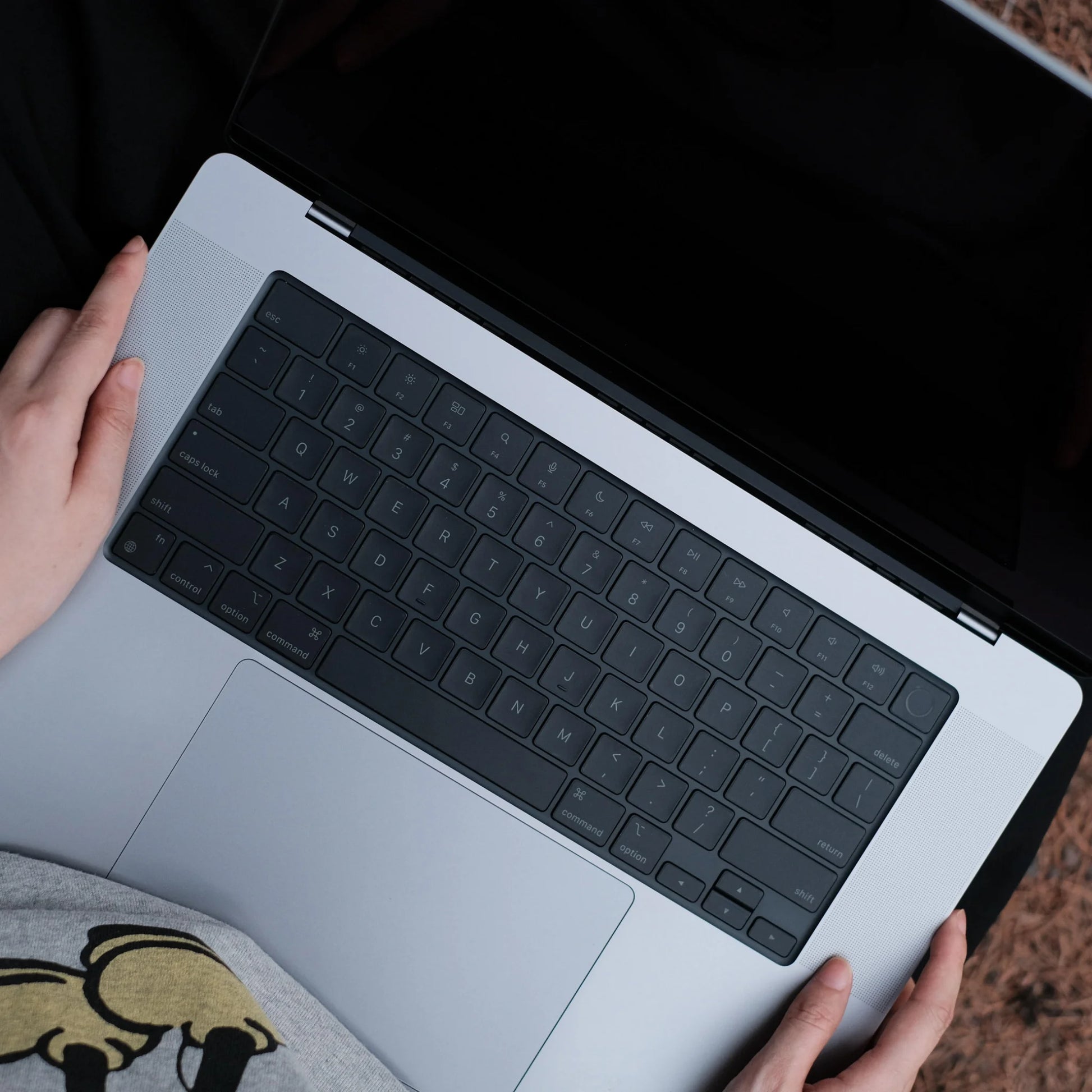 MacBook keyboard skin lifestyle dark desk setup — Barekey